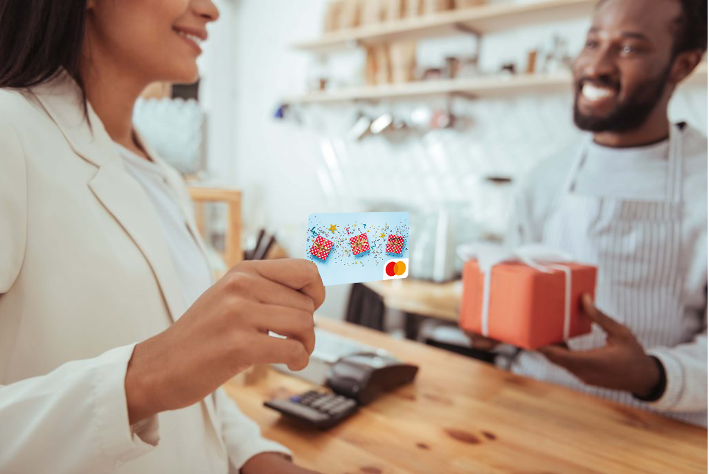 Woman using her Mastercard Gift Card at a retail store checkout