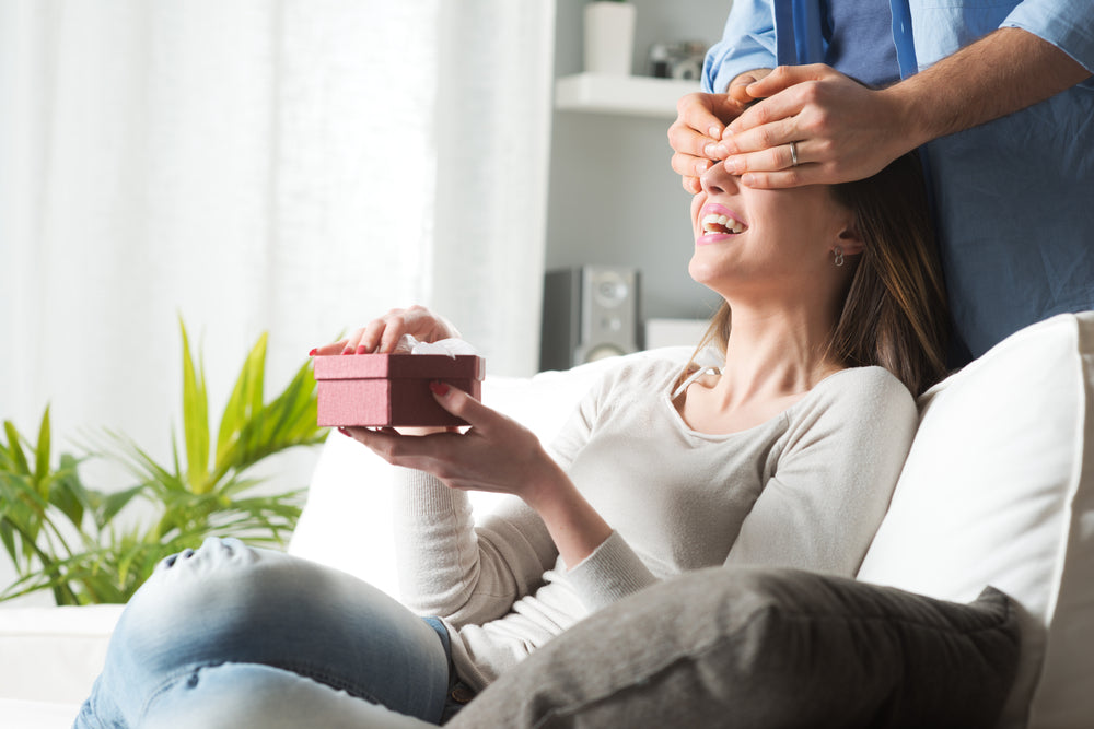 Man surprising his fiancée with a romantic gesture