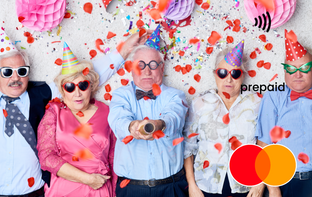 Group of people wearing party hats Mastercard gift card shop at Gift Card Store