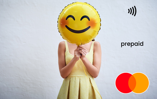 Person holding a yellow smiley face Mastercard gift card shop at Gift Card Store