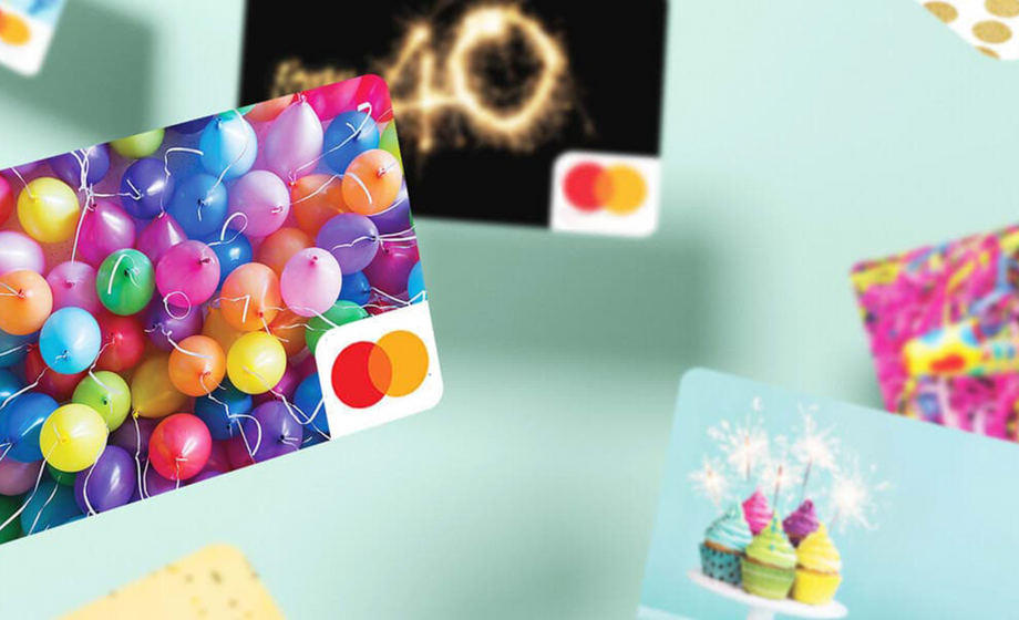 Colorful birthday-themed Mastercard gift cards on a light blue background