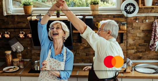 Senior couple celebrating in a kitchen featured on a Mastercard Personalised Gift Card 