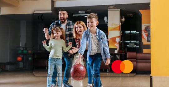 Family of four at a bowling alley featured on a Mastercard Personalised Gift Card 