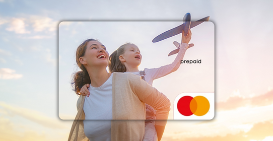 Woman and child playing with a toy airplane in front of a Mastercard prepaid card.