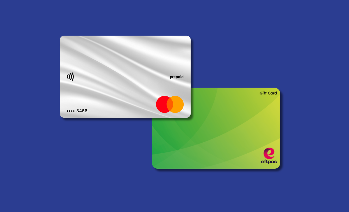 Two cards, one silver and one green with a logo, on a blue background